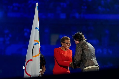 Tom Cruise greets Los Angeles Mayor Karen Bass during the 2024 Summer Olympics closing ceremony